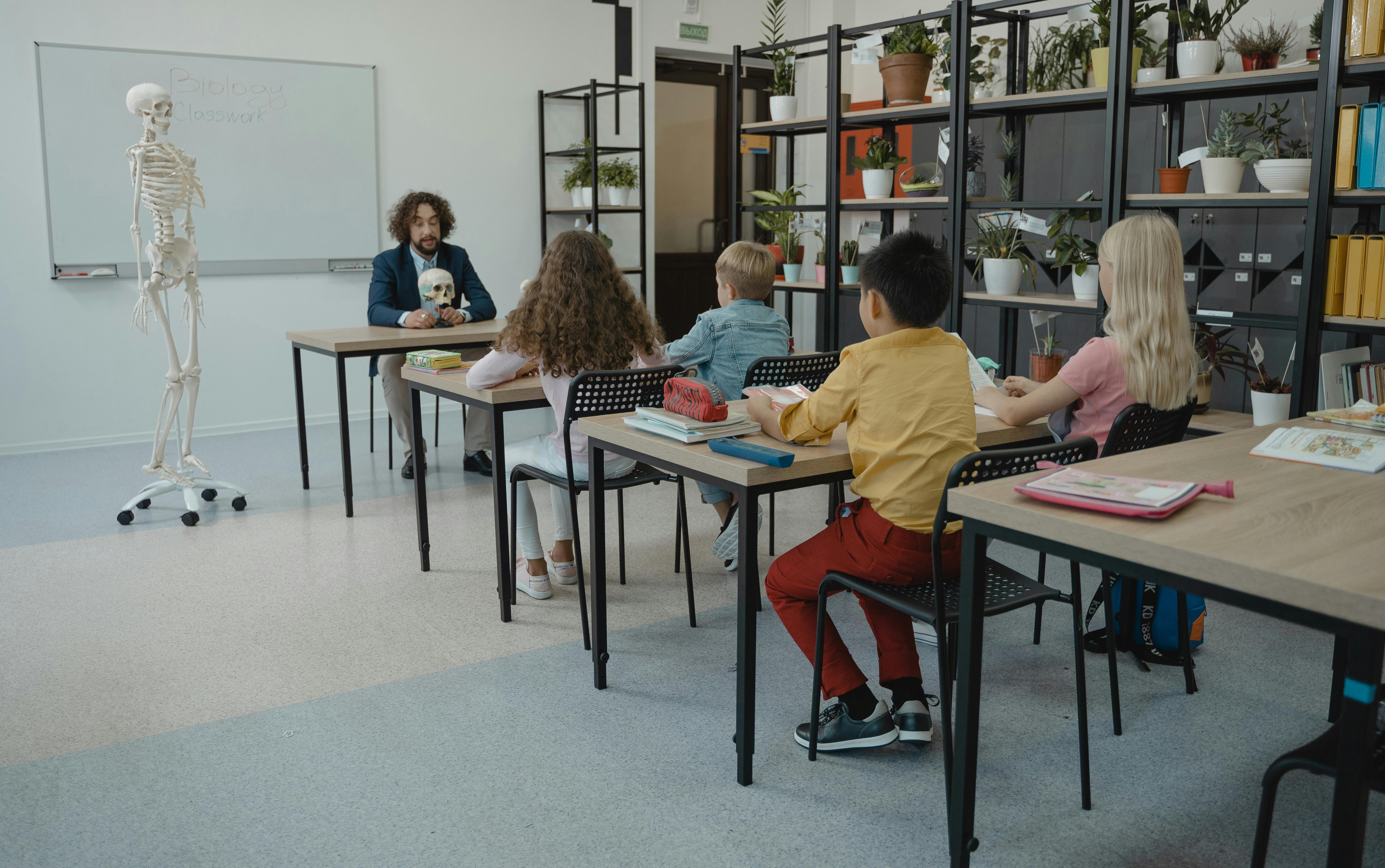 A classroom with a teacher and four students
