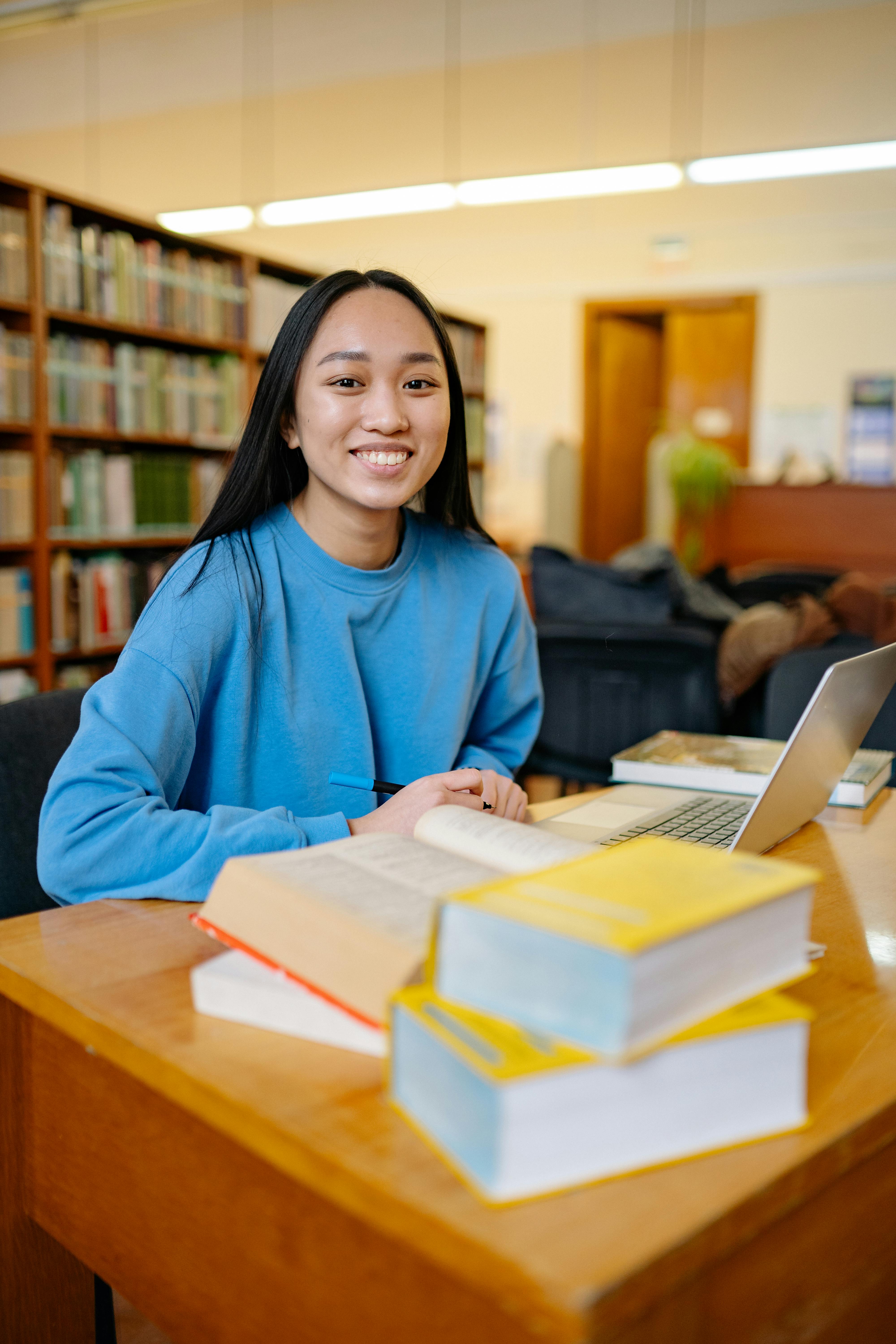 A student studying at a library.