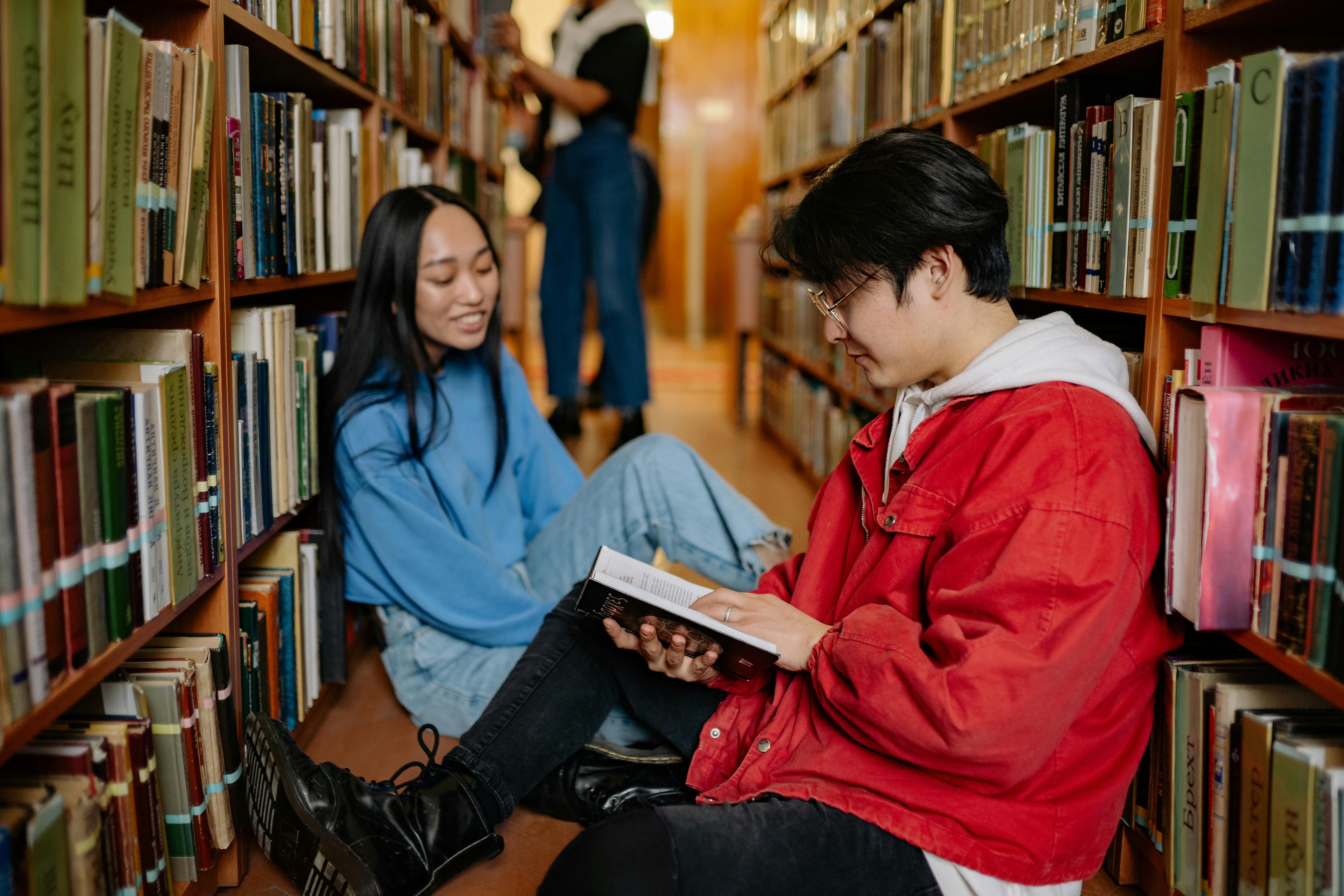 Two students studying in a library