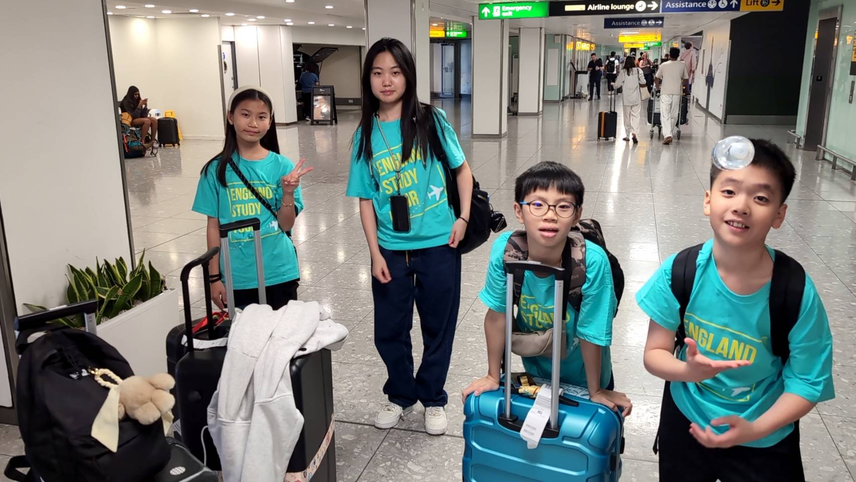 Four Taiwanese students in a UK airport on their way to summer camp